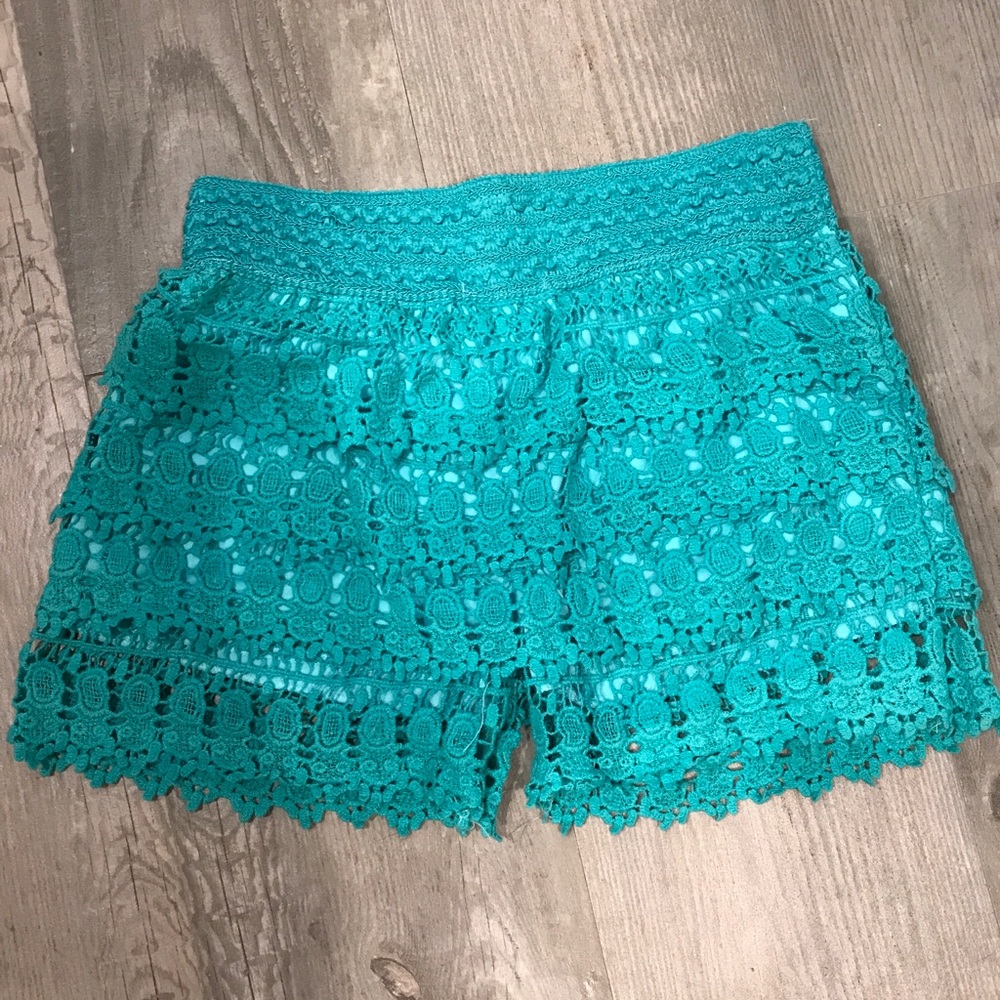 Laced pattern teal shorts